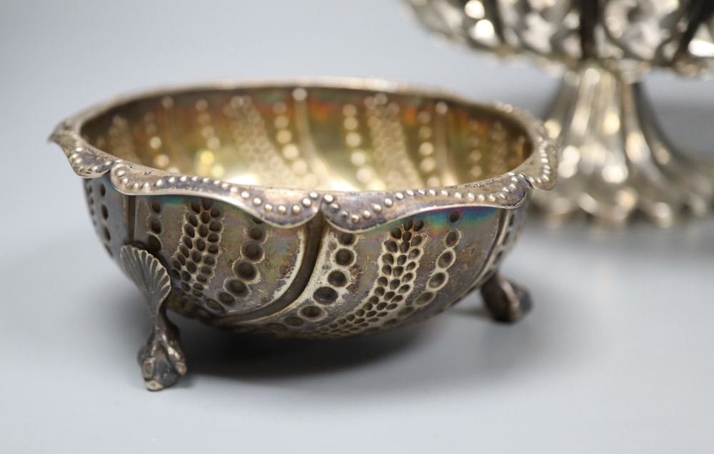 A pierced and embossed silver footed bowl, maker C.C, Chester 1907 and two silver sugar bowls, approx 13oz